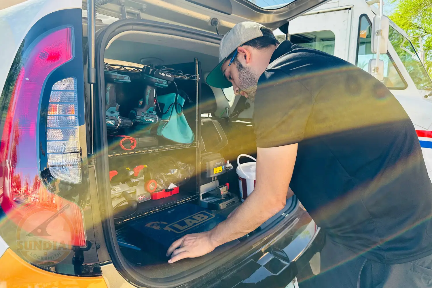 Our Sundial Locksmith tech working diligently inside a service van.