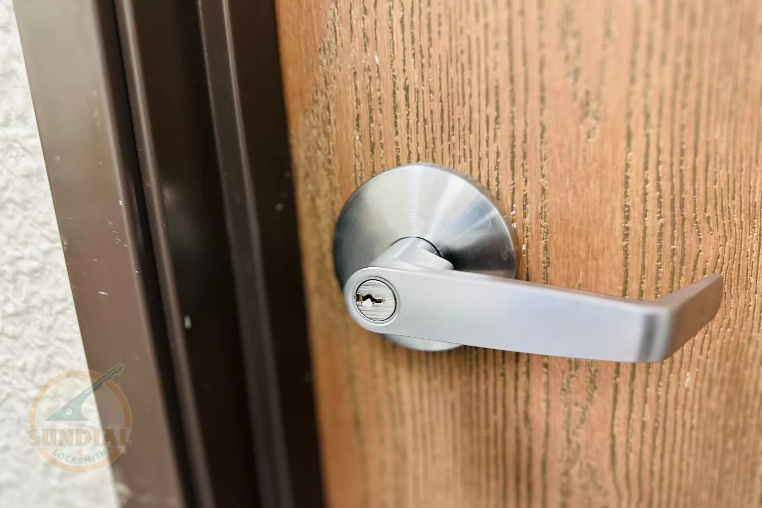 Close-up of a modern door handle and lock.