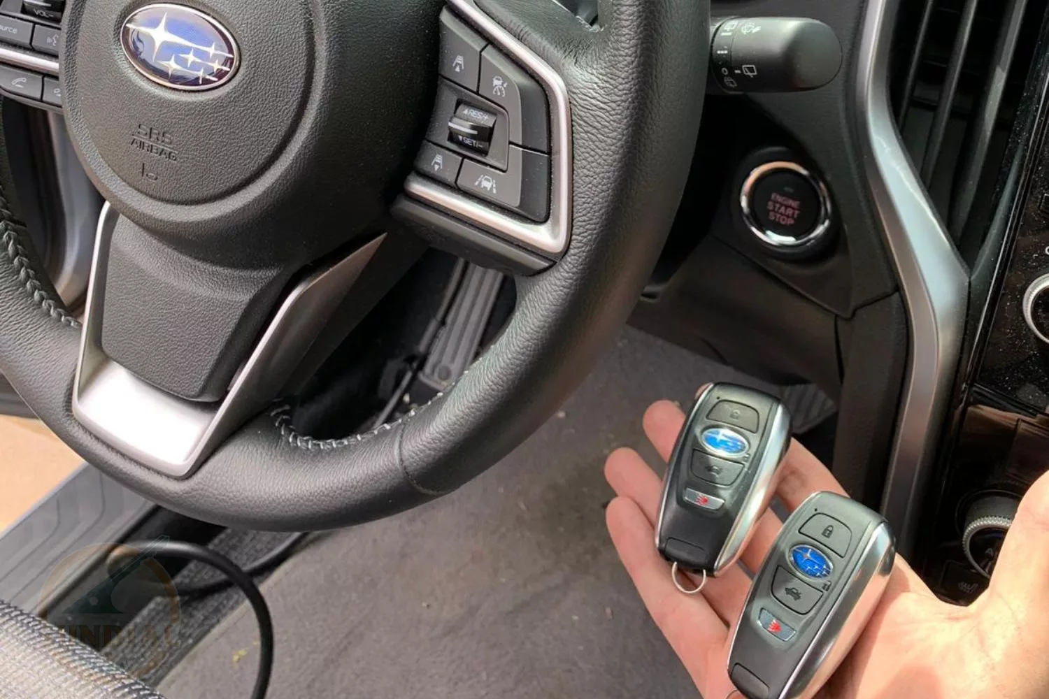 Subaru vehicle steering wheel with car key fobs