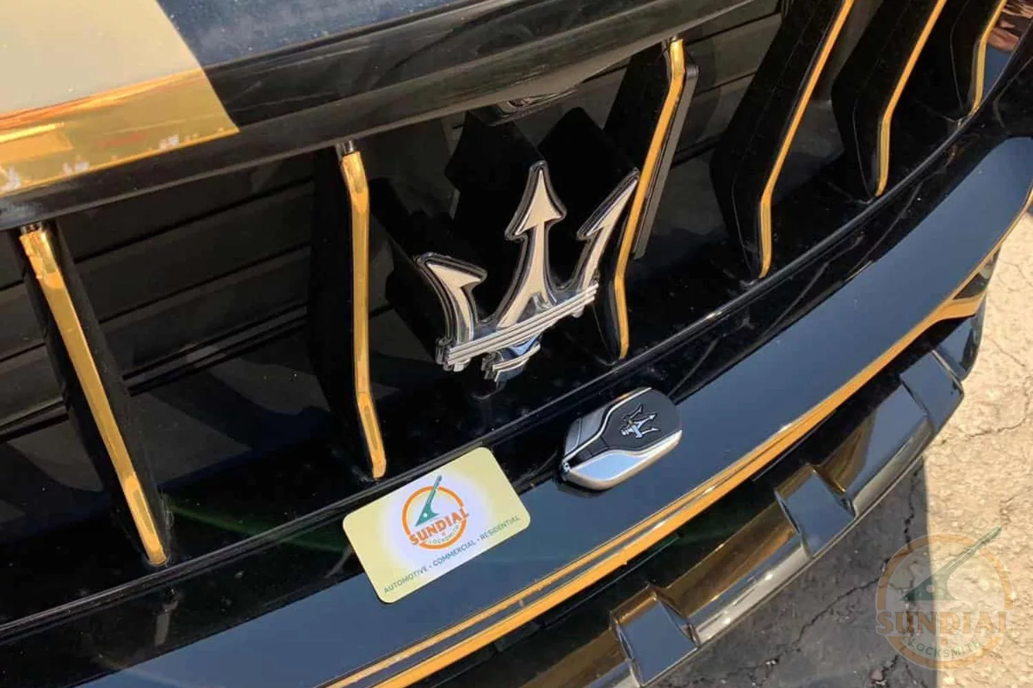 Car emblem close-up with black and gold details.