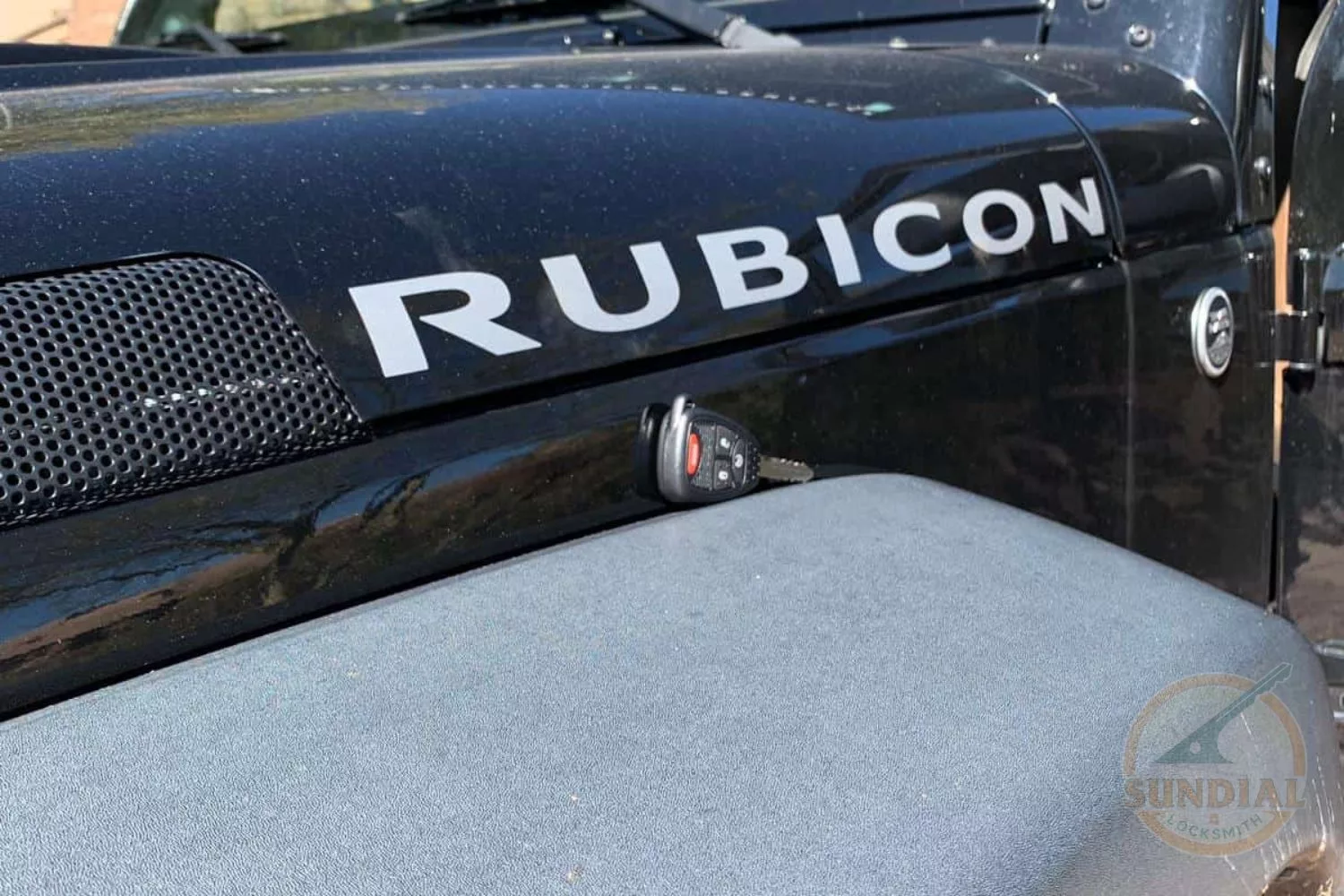 Rubicon car fender with key fob placed on top.
