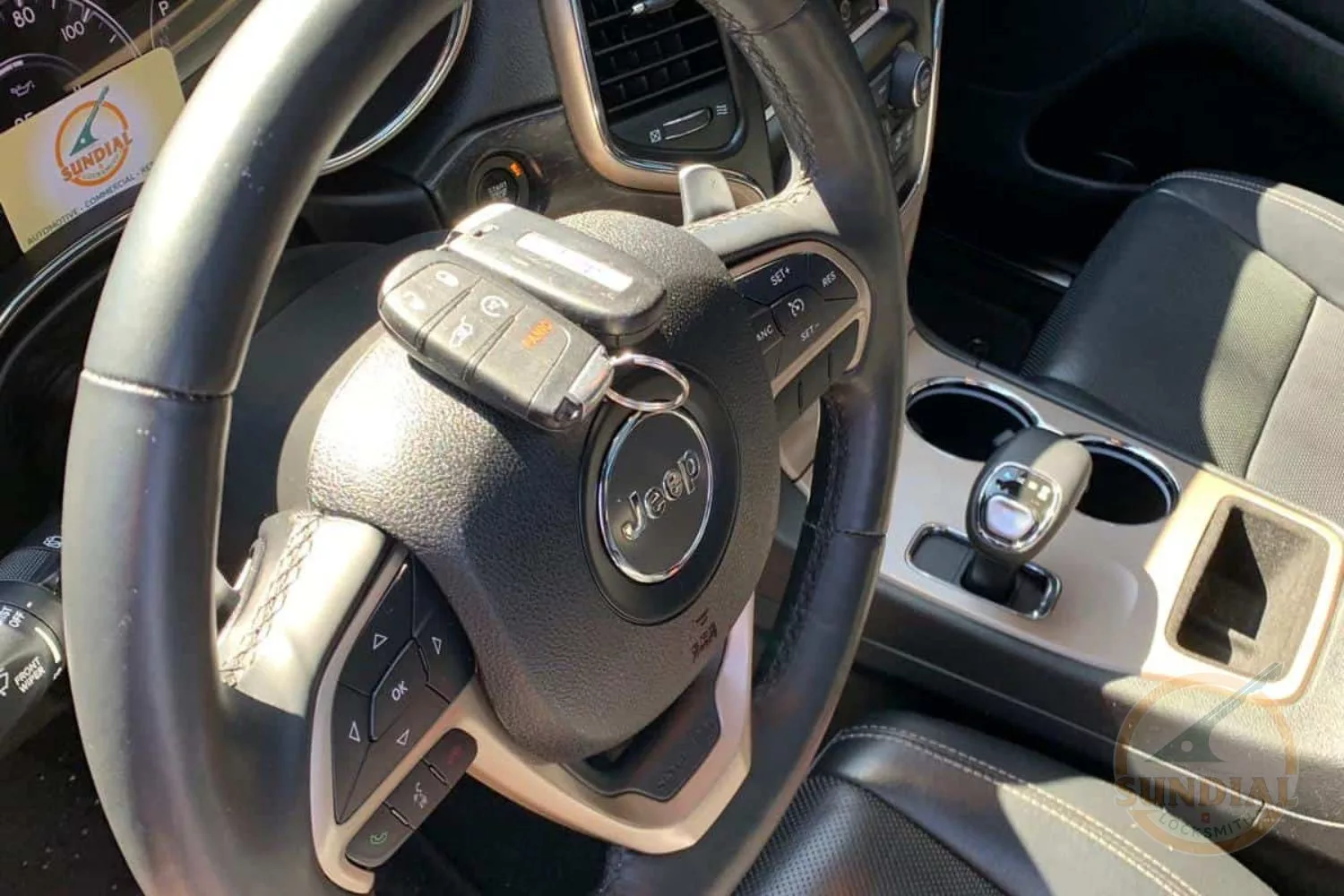 Jeep steering wheel and vehicle interior details.