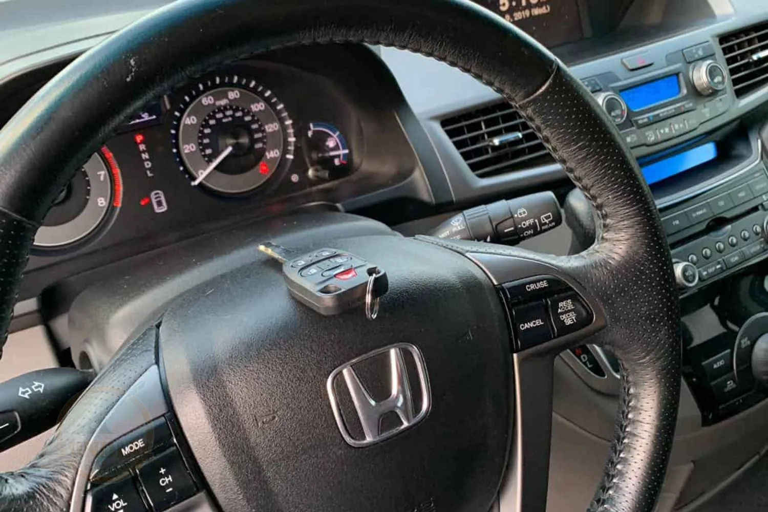 Car interior with Honda steering wheel and key fob.
