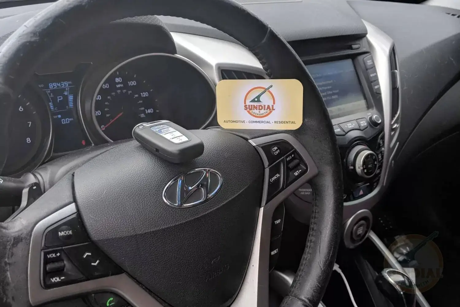 Hyundai car interior with steering wheel and Sundial card.