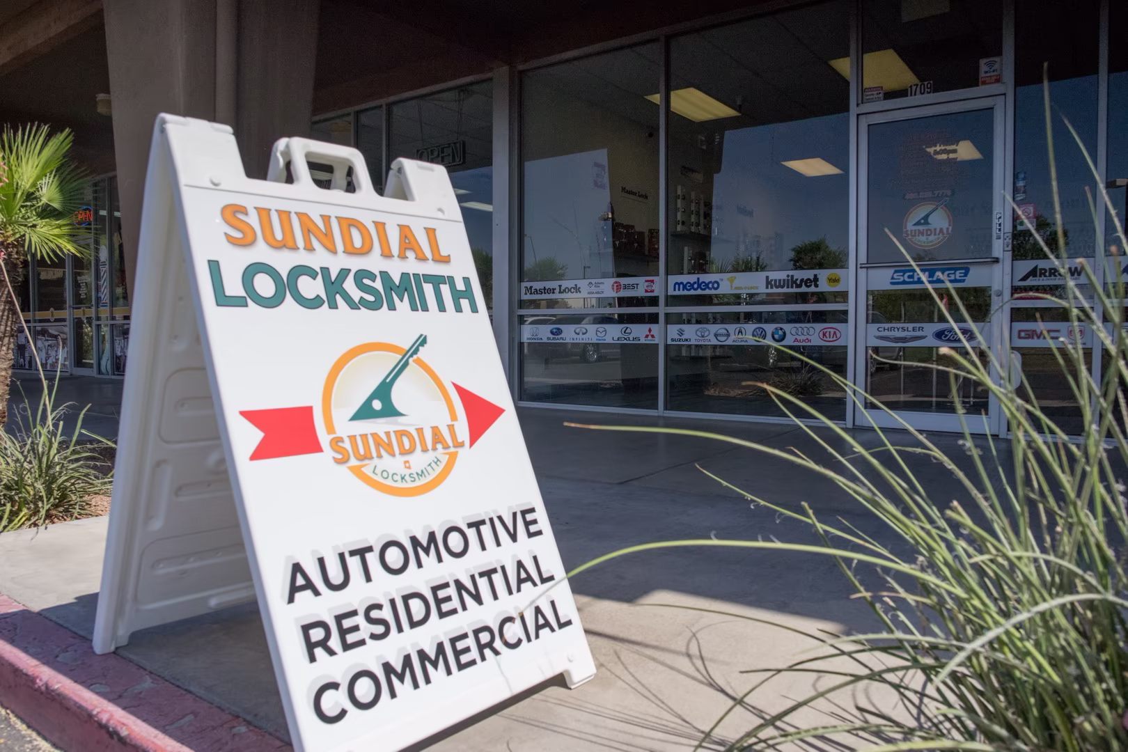 Should You Use a Commercial-Grade Lock on Your Home? Here's the Honest Answer A locksmith installing a commercial grade lock for residence on a solid wood front door in warm Arizona afternoon sunlight