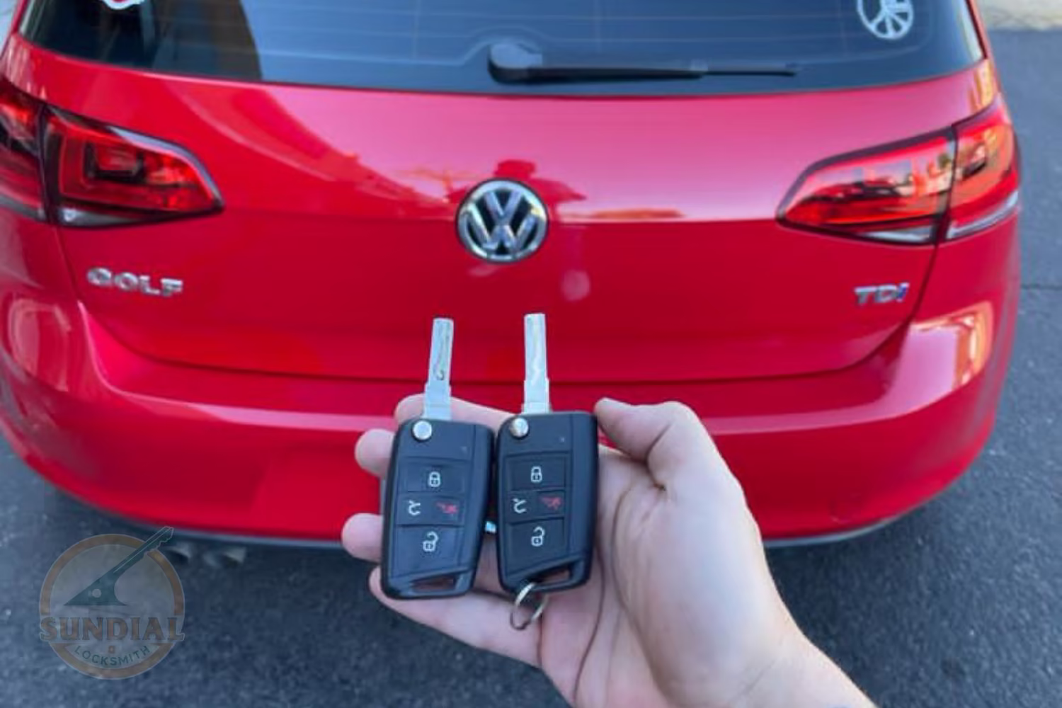 An automotive locksmith programming a new car key on-site in a sunny Arizona parking lot — the cost of new car key without spare depends on vehicle type and key technology.