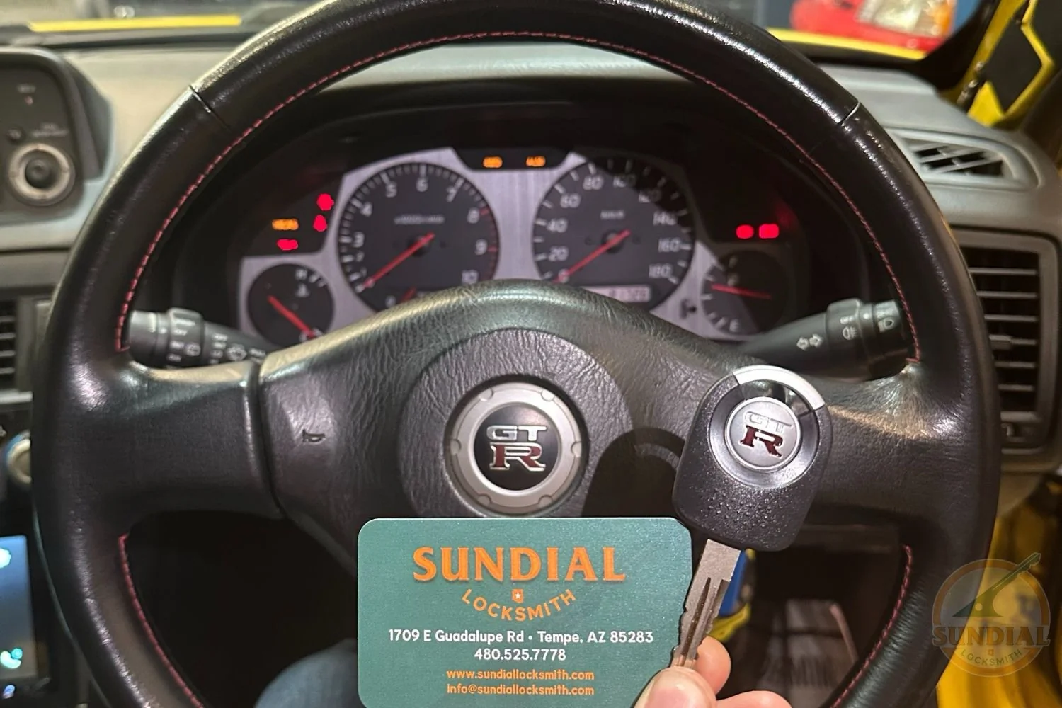 Why a Locksmith with a Real Storefront Is Different from a Van with a Phone Number A locksmith with dedicated service vehicles technician standing beside a fully stocked professional service vehicle outside a real locksmith storefront in the Phoenix metro area